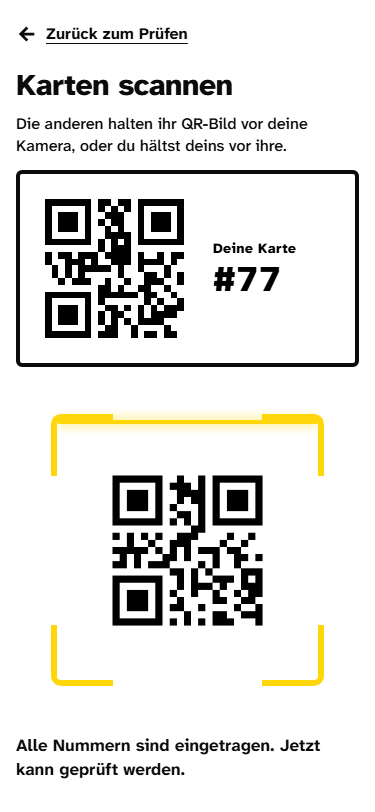 Handy mit dem eigenen QR-Bild und dem Kamerafenster, das eine Karte erkennt